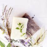 Natural soap with various herbs, top view, toned.