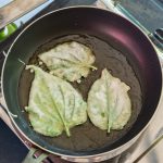 fried ChaPlu leaf (Wild Betel Leafbush) in the pan for eat with traditinal Thai food.